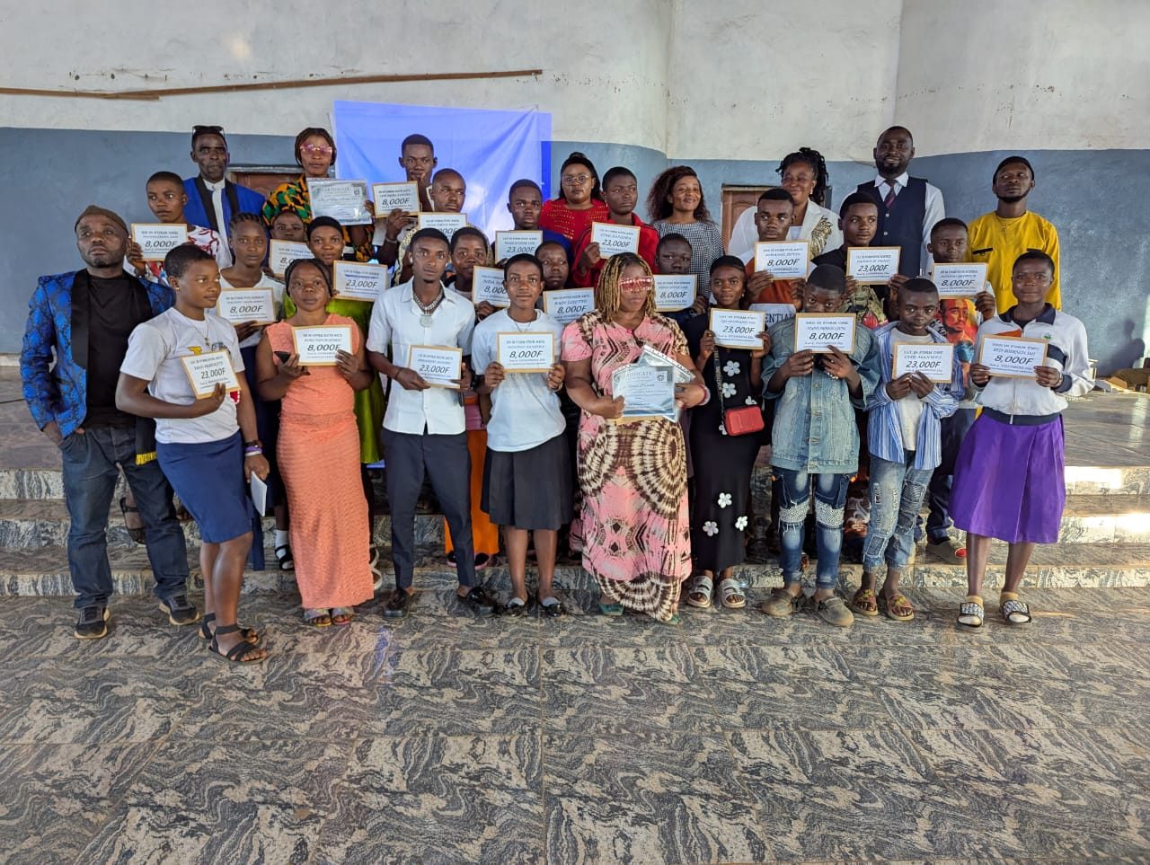 Students receiving prizes and certificates at the Intentional School Summit